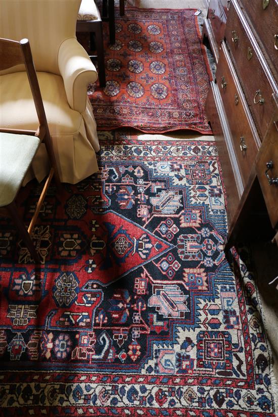 Two Afghan red & blue ground rugs